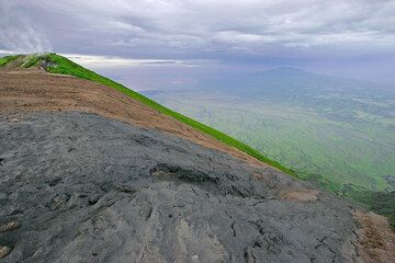 An overflow onto the steep eastern flank of the volcano. Lake Natron and Mt Gelai volcano in the background. (Photo: Tom Pfeiffer)