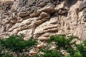 Cliffs of old limestone flank the area of Devil's Bridge where the river is covered by naturally grown travertine. (Photo: Tom Pfeiffer)
