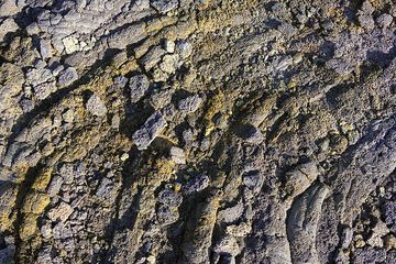 Colorful oxidized and weathered structures of old lava found on Erta Ale shield volcano. (Photo: Tom Pfeiffer)