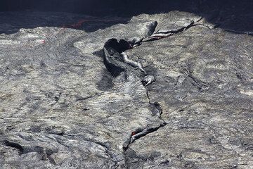 A collision zone between two plates of the lava lake's crust where one plate is thrusted over the other plate.  (Photo: Tom Pfeiffer)