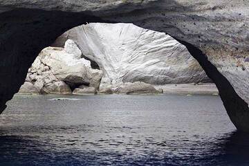 Sea arch formed in white ash layers at the N coast of Milos Island, Greece (Photo: Tom Pfeiffer)