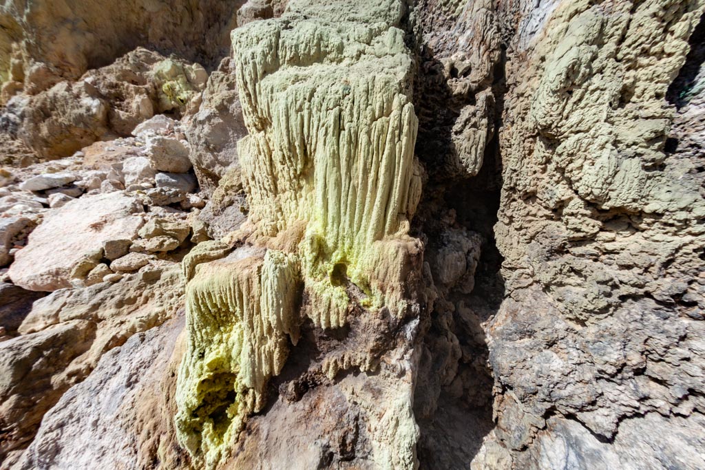 Stalagmites of sulphur in the crater walls of Polyvotis lava dome on Nisyros island. (Photo: Tobias Schorr)