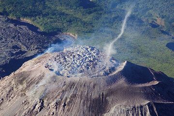 Turbulence creates a dust devil rising ash from the lava dome (Photo: Tom Pfeiffer)