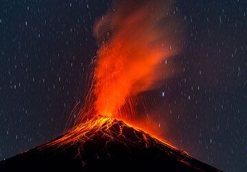Fuego volcano during a strong strombolian explosion seen from the southwest. (Photo: Tom Pfeiffer)