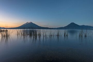 View of Toliman and San Pedro volcanoes from the lake shore at dawn. (Photo: Tom Pfeiffer)