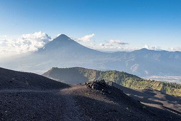 View to the north with the caldera rim of Pacaya in middle and the majestic silhouette of Agua stratovolcano in the far background. (Photo: Tom Pfeiffer)