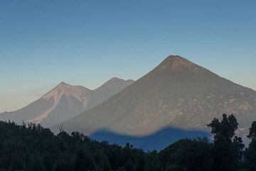 Morning view of Fuego, Acatenango, and Agua. (Photo: Tom Pfeiffer)