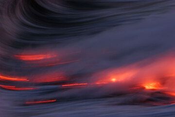 Glowing lava pulled by the ocean waves (Kilauea volcano, Hawai'i) (Photo: Tom Pfeiffer)