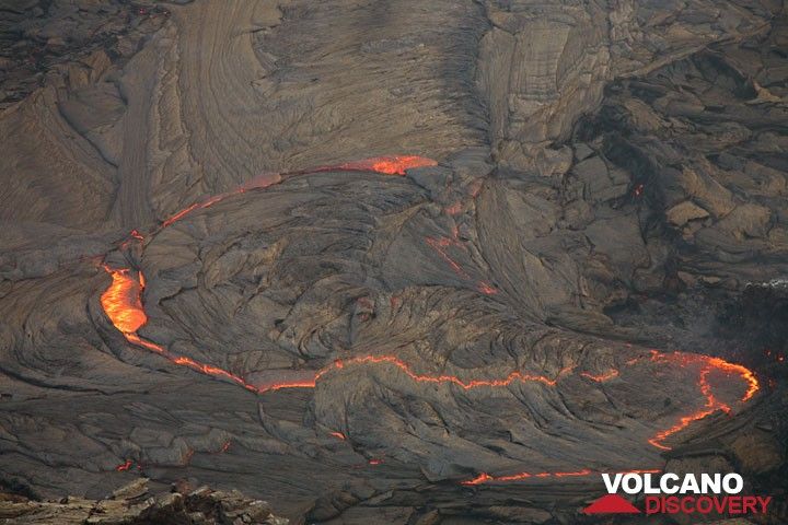 The lava lake at dusk and an initial stage of crust overturn in the center.  (Photo: Tom Pfeiffer)