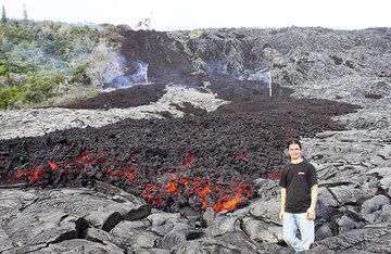 Philip stands by the leading edge of an 'a'a lava flow at the base of Pulama Pali, being fed from the Peace Day Fissure on Pu'u 'O'o vent on K?lauea volcano on December 4, 2011. (Photo: Philip Ong)