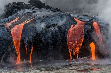 Lava pours constantly - most is used to create black sand. (Photo: Tom Pfeiffer)