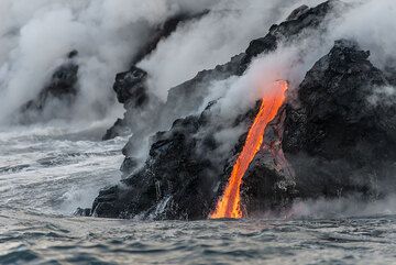 A lava flow continues quietly its work to make new land. (Photo: Tom Pfeiffer)