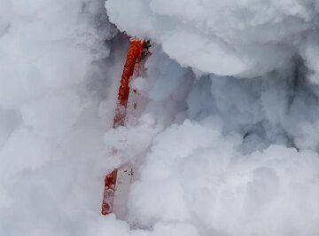 The large collapse on New Year's Eve 2016 removed most of the lava delta formed since July 2016 and parts of the older shore, exposing the lava tube. A continuous jet of lava, a fire hose, was shooting out from there directly into the ocean for almost 3 months. Only by 20 March, the lava managed to rebuild a new land delta, allowing the lava hose to encase itself again. (Photo: Tom Pfeiffer)