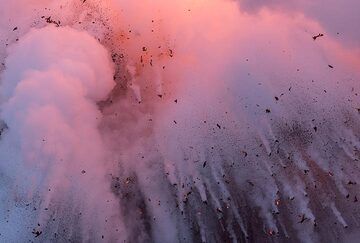 Pink steam and falling bombs. (Photo: Tom Pfeiffer)