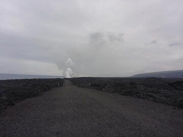 Day 2: The new road formed towards the Kamokuna lava ocean entry of which the billowing steam plume can be seen in the background (the old asphalted road has been destroyed and burried by previous lava flows) (Photo: Ingrid Smet)