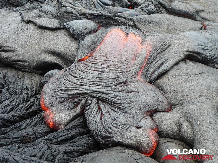 Active pahoehoe lava front flowing down older lava flows and forming the typical ropey crust (Photo: Ingrid Smet)