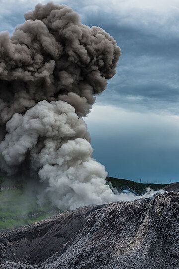 Small mushroom ash cloud rising from Ibu's vent. (Photo: Tom Pfeiffer)