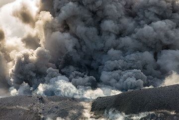 Ash emission from Ibu volcano's lava dome. (Photo: Tom Pfeiffer)