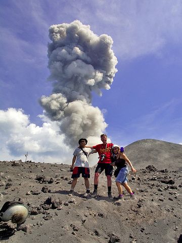 Our guide Andy, Markus and Thea in front of erupting Anak Krakatau volcano in July 2009. (Photo: Tobias Schorr)