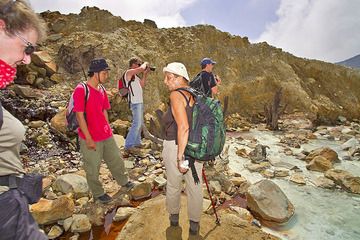 The VolcanoDiscovery group at the acid creek inside the crater of Papadayan volcano (Photo: Tobias Schorr)