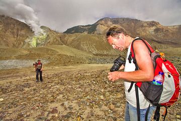Markus checking his camera in front of Papadayan crater (Photo: Tobias Schorr)
