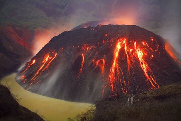 Muddy brown color of the remnant of the lake, now largely replaced by the active growing lava dome (Kelut volcano, East Java, Indonesia). (Photo: Tom Pfeiffer)