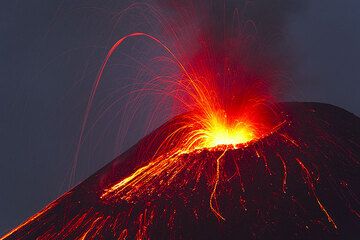 Eruption at dusk from the new crater that has gown a new cone inside the 2007 crater. (Photo: Tom Pfeiffer)