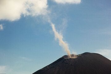 A little tornado of ash forming from a large eddy in the air above the crater. (Photo: Tom Pfeiffer)
