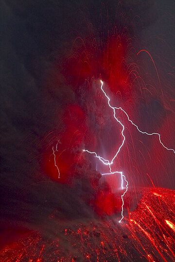 One of the rare (every 2-12 hrs approximately) vulcanian-type explosions at night with a large lightning forming inside the turbulent ash cloud. (1 Sep 09) (Photo: Tom Pfeiffer)