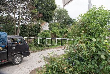 The road from Sibintun to Sukameriah villages (SE side) is blocked as we enter the exclusion zone (with permission) for a short visit. (Photo: Tom Pfeiffer)