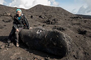 A giant "cannolo"-shaped lava bomb from the New SE crater. 1971 cinder cone in the background. (Photo: Tom Pfeiffer)