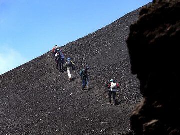 The VolcanoAdventures group hiking towards the fissure eruption of Etna volcano in May 2019. (Photo: Tobias Schorr)
