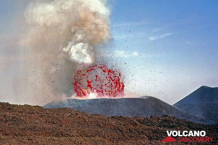 A perfect lava bubble, about 40 m across explodes inside the new crater. (Photo: Tom Pfeiffer)