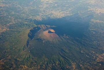 Vesuvius volcano near Naples, Italy, seen from the air. The rim of the remnant of the older Somma volcano which collapsed in the 79 AD Plinian eruption is clearly visible to the left of the new Cono Grande cone with its crater. (Photo: Tom Pfeiffer)