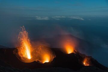 NW and eastern crater in eruptions. Moonshadow of the island over the sea in the background. (Photo: Tom Pfeiffer)