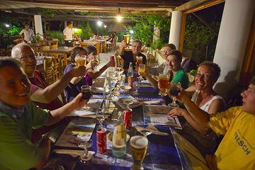 A well-deserved beer, coke and pizza after the climb! (Photo: Tom Pfeiffer)