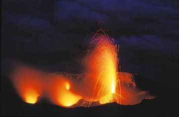 Strong candle-like eruption from the central crater vent of Stromboli.
 (c)