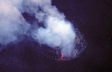Glowing lava inside the central crater vent of Stromboli volcano (c)