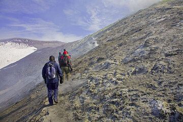 We have passed the fumaroles and are now heading towards the northeast crater, visible in the background. (c)