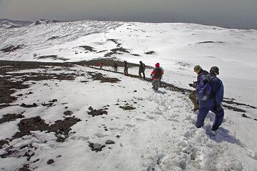 it's time to leve the summit craters and descend through soft snow and ash. (c)