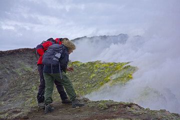 Rosario leading Inès to the edge of the deep pit crater (Photo: Tom Pfeiffer)