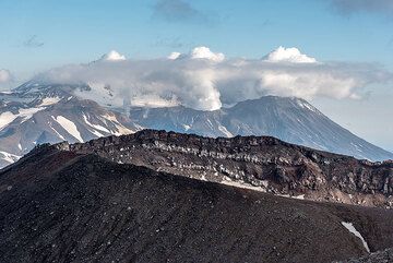 View over Gorely's SE summit crater towards the SE, where the summit of neighboring Mutnovsky volcano is seen. (Photo: Tom Pfeiffer)