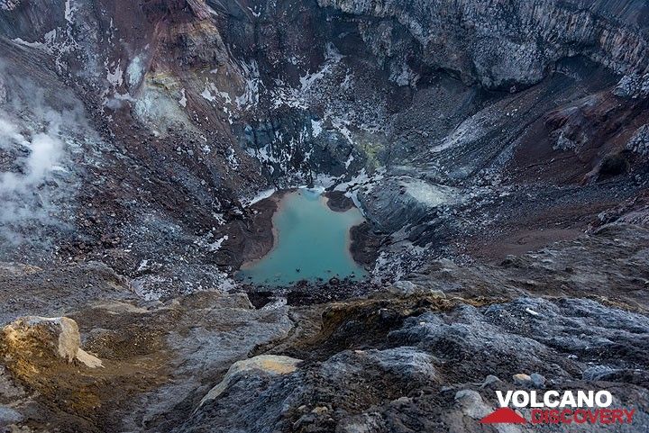 The NW crater of Gorely, site of the most recent episode of unrest at the volcano during 2013-14 when a vent next to the small acid lake was emitting a hot jet of incandescent gas (at 900 deg temperatures). Now, it is calm again, but for how long? (Photo: Tom Pfeiffer)