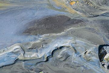Abstract shapes and lines from fine-grained mud deposits near a fumarole. (Photo: Tom Pfeiffer)