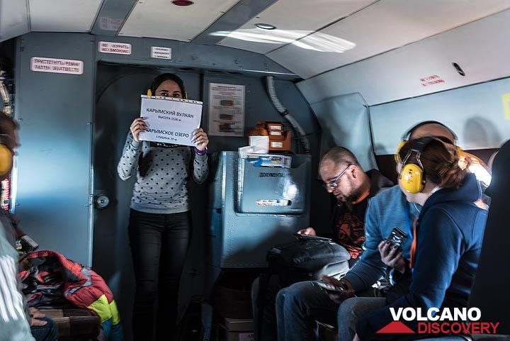 An announcement by the flight attendant: we are about to reach and overfly Karymsky volcano. (Photo: Tom Pfeiffer)