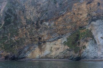 Dramatic coastlines of eroded volcanic rocks. (Photo: Tom Pfeiffer)