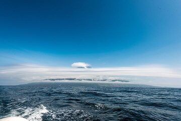 Alaid, tallest peak of the Kuriles, dresses itself majestically in rings of clouds. (Photo: Tom Pfeiffer)