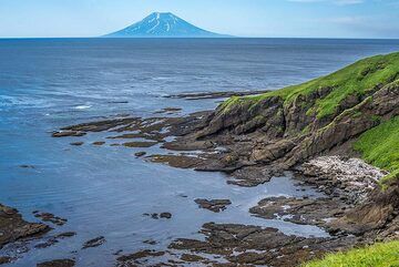 Small bay in the shoreline with Alaid in the background (Photo: Tom Pfeiffer)