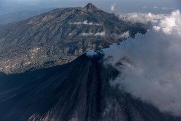 View from the south with Colima and its active lava flow (dark tongue) and Nevado in the background. (Photo: Ingrid Smet)