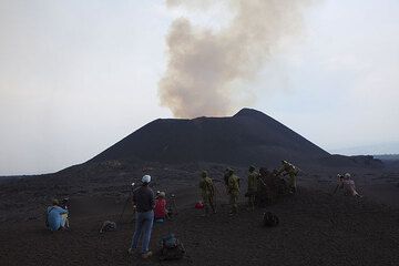 Before climbing the western cone, we watch from a safe location near the base of the western cone. (Photo: Tom Pfeiffer)